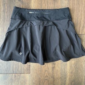 Lululemon off the pleats black athletic skirt, built in shorts, women’s size 4